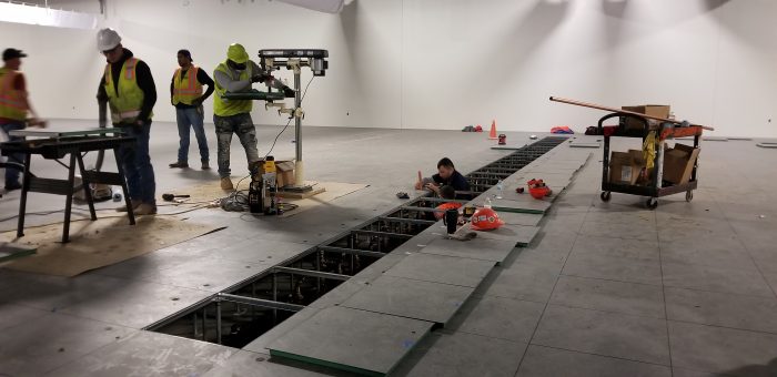 Holes are cut into the floor for pipes